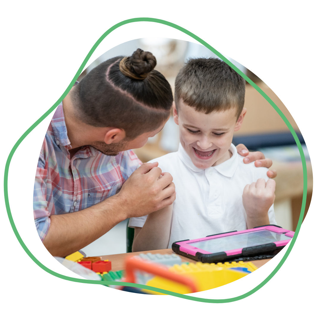 Teacher and young boy with an iPad