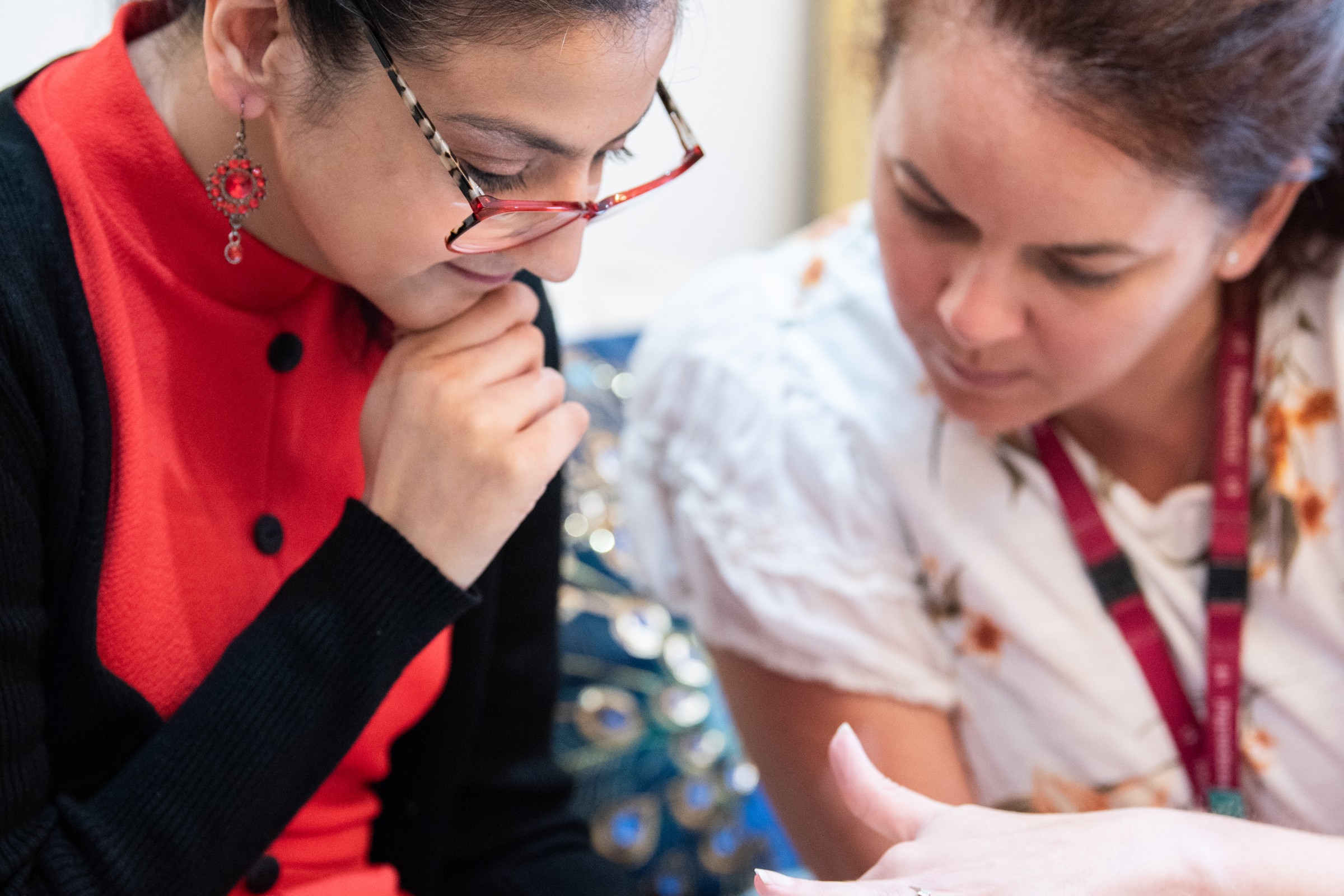 Sufina and her SLT, Emily are looking at Grid on a Talk Pad device.
