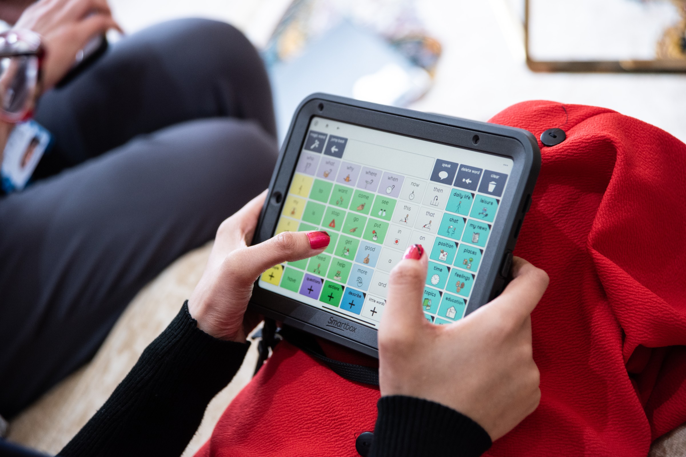 Sufina using Grid on her Talk Pad with Super Core symbol vocabulary.