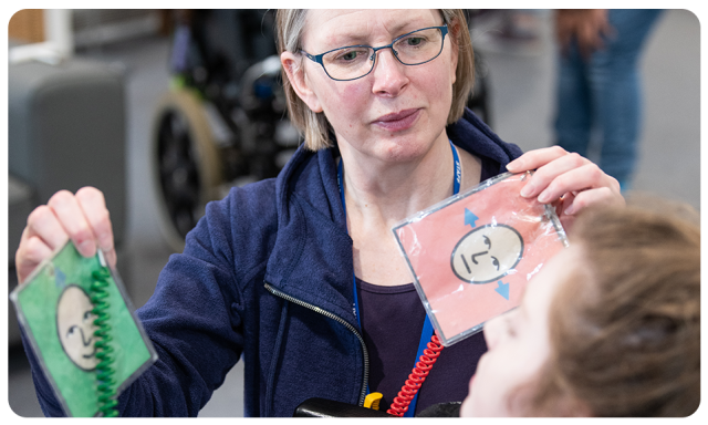 A communication partner using paper-based AAC for yes and no