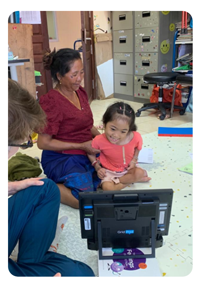 therapist and child with grid pad