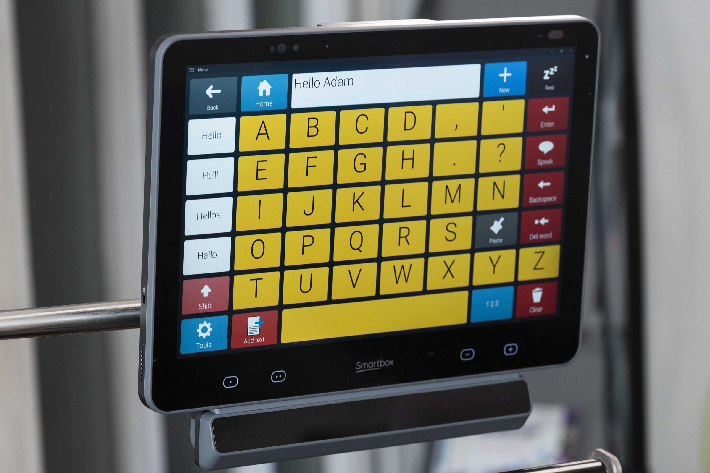 Grid Pad with the keypad open, displaying 'Hello Adam' written on the screen using Eye Gaze.