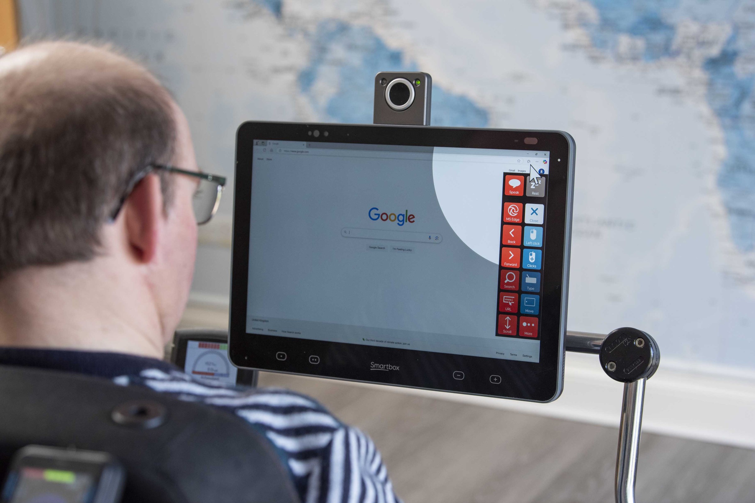 A man using Grid Pad 16 to browse Google.